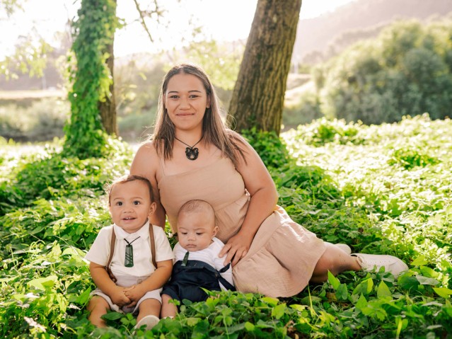 Mother with two children in woodland settings